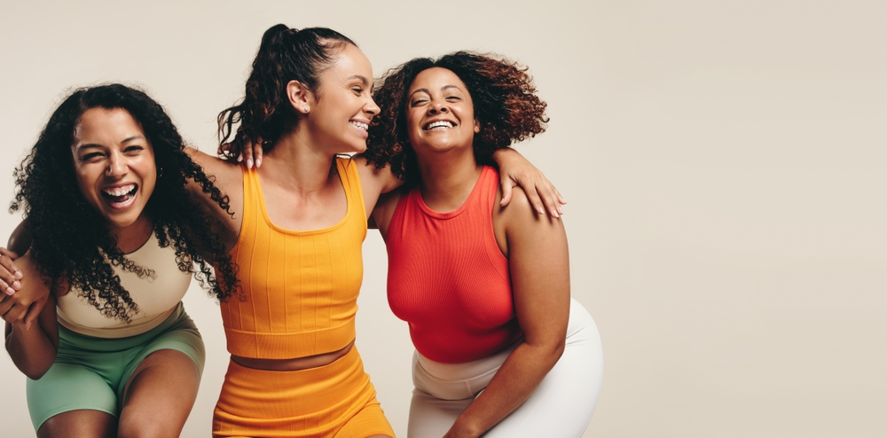 Three women friends laughing