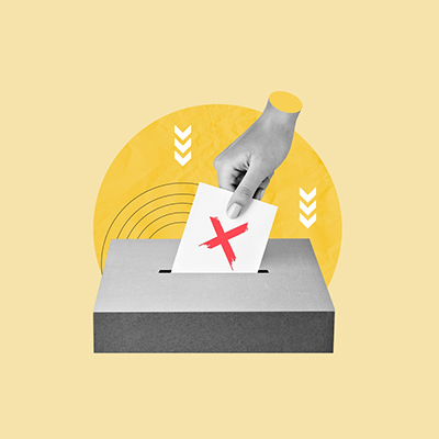 Hand placing ballot into box with X