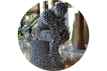 The Thinker (statue) created out of canned and boxed foods