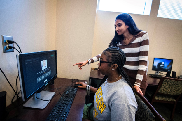 KSU Graduate Research Assistant Bhavitha Redrouthu (standing) and KSU Psychology major and Criminal Justice minor Madison Blackmon simulate an experimental Situational Attribution Training session.