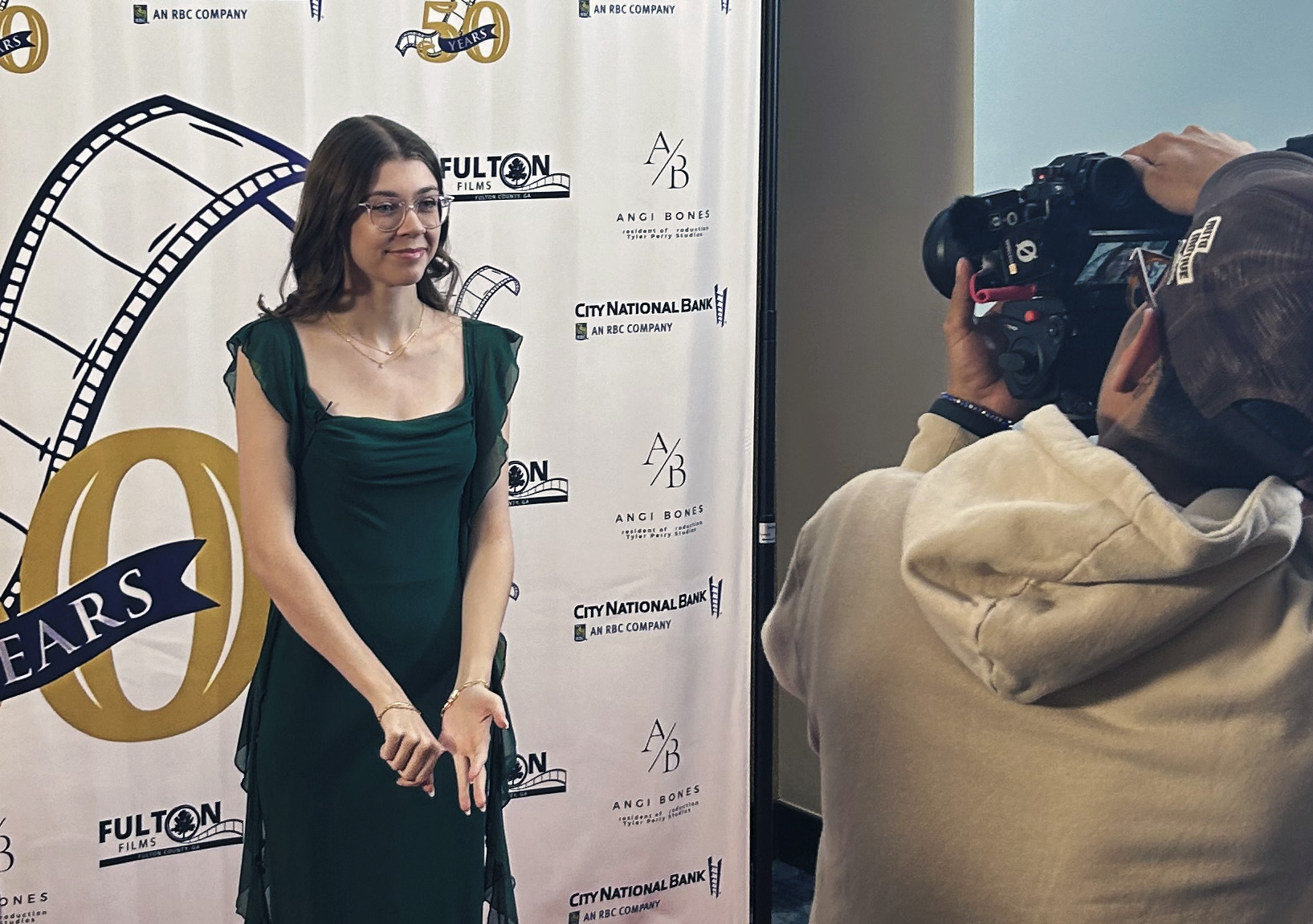 Brianna Barros being photographed at the Women in Film/TV (WIFT) 50th Anniversary Gala