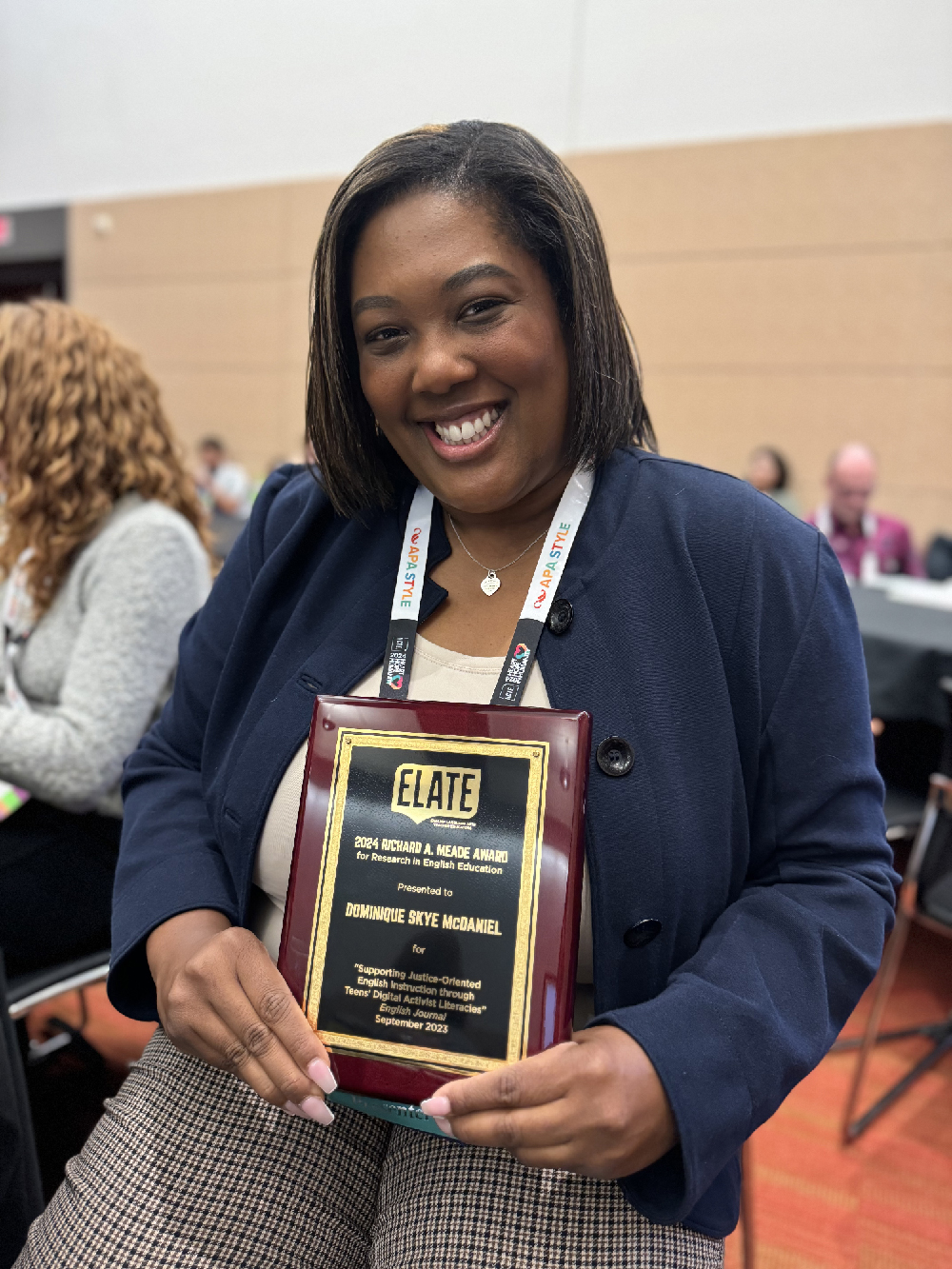 Dominique S. McDaniel, Ph. D pictured with her ELATE Richard A. Meade Award plaque