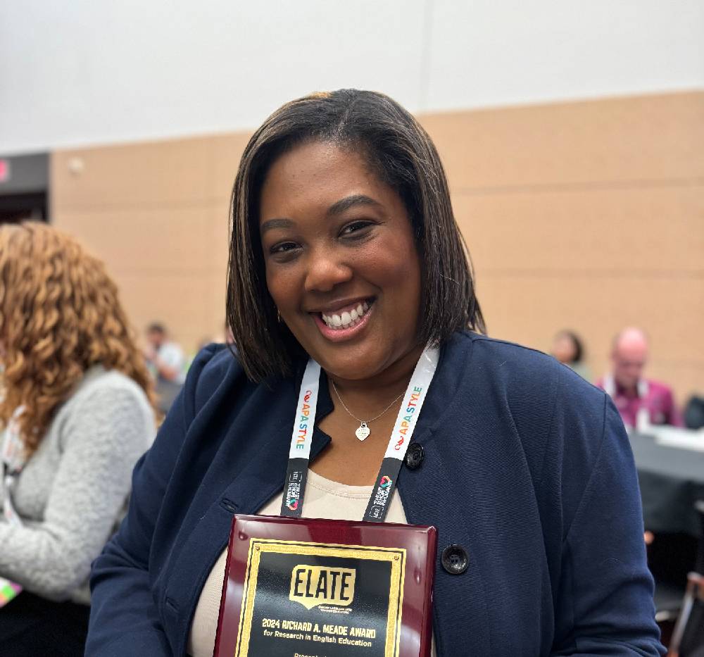 Dominique S. McDaniel, Ph. D pictured with her ELATE Richard A. Meade Award plaque.