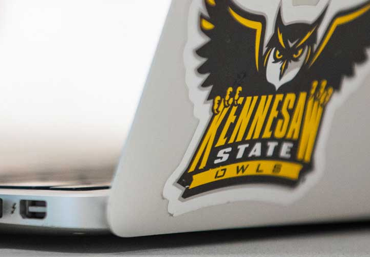 Corner of Open Laptop with Kennesaw State sticker