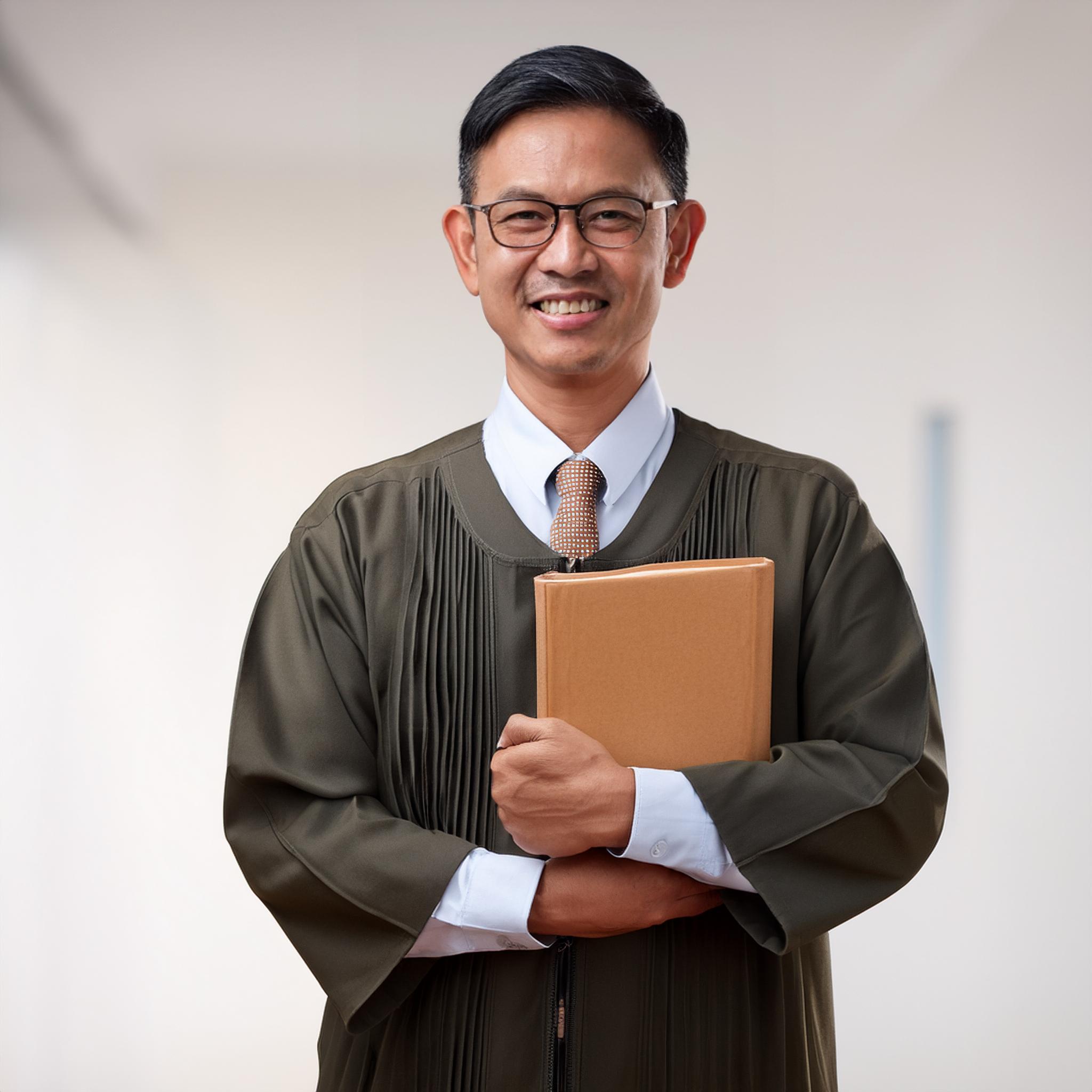 Faculty member holding book