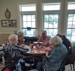 mature adults sitting at table