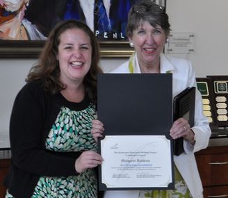 Margaret Robbins (left) receives the KMWP Teacher Leadership Award for 2013 from KMWP Fellow Kitty Drew.