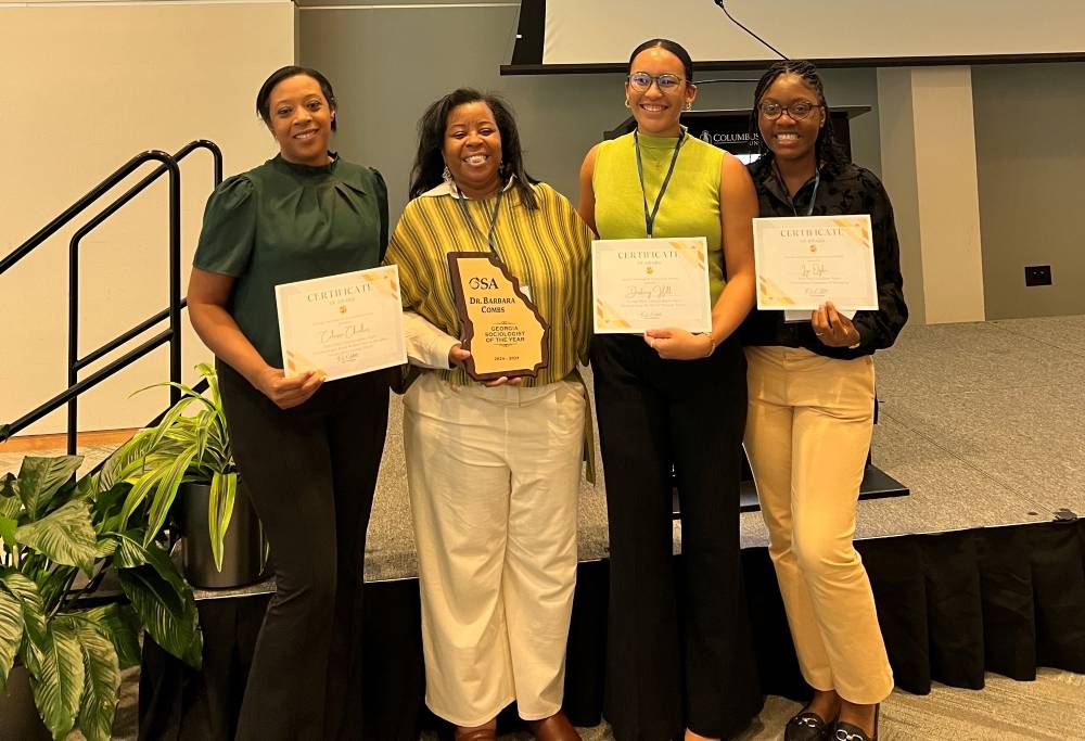 Dr. Barbara Combs with students Destiny Hill, Calissa Charles & Iye Ogbe 